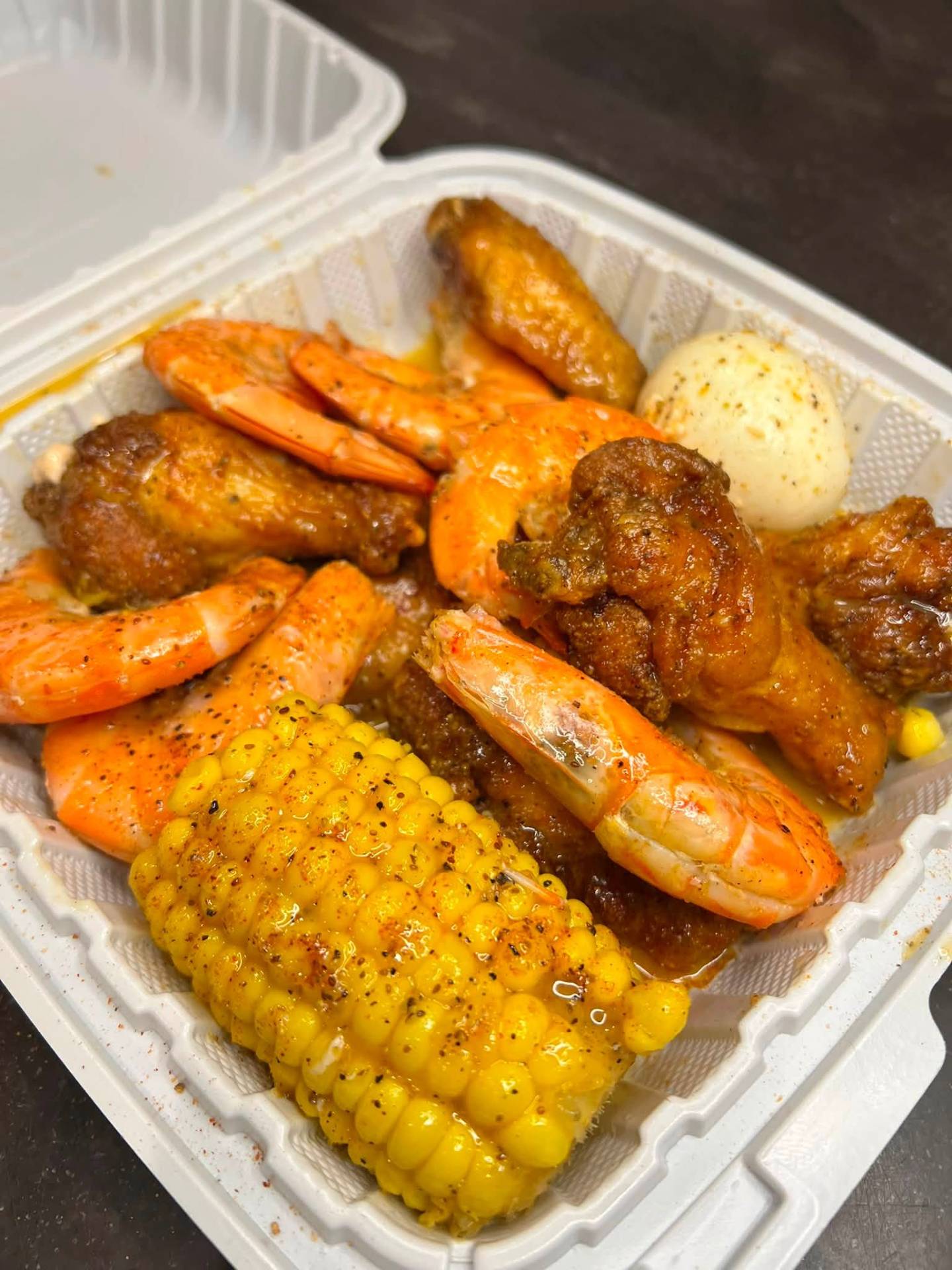 Boiled shrimp, wings, corn and egg