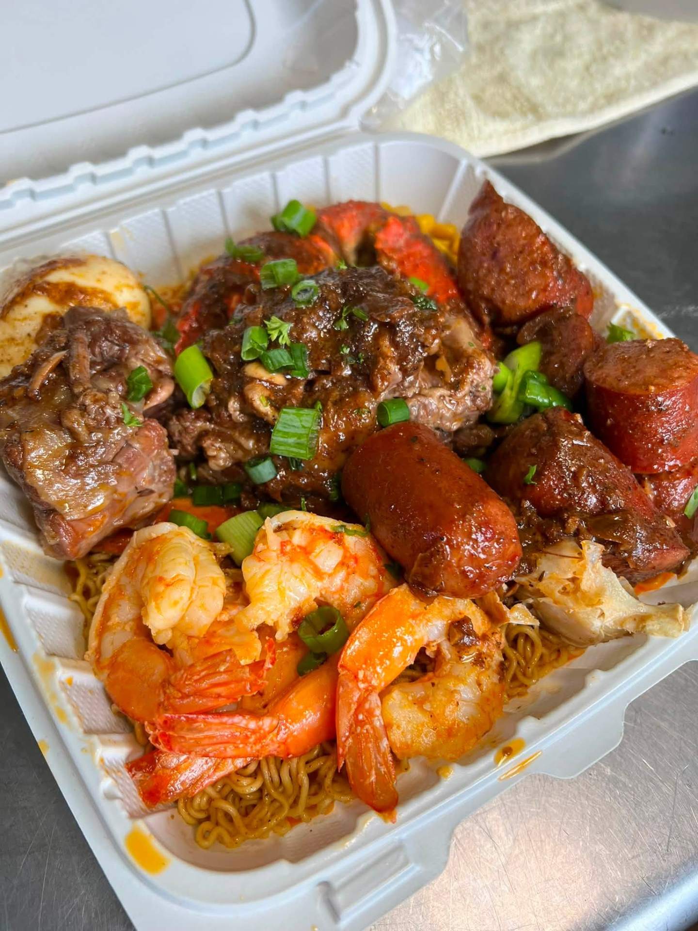 Seafood boil ramen with oxtail and shrimp